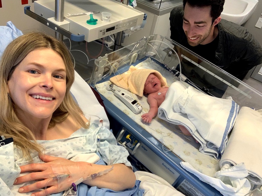 Sophie and Peter at their newborn son's bedside.