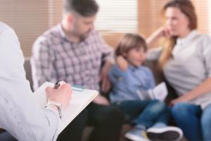 father mother and child in family therapy