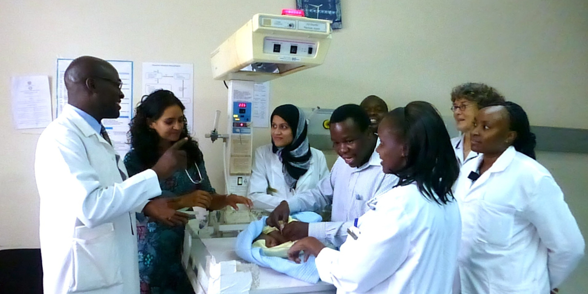 Health-care workers on morning rounds at a teaching hospital in Kenya