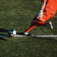 Kicking soccer ball