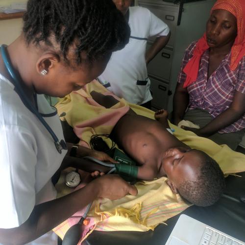 Health care team in Uganda treating a patient