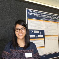 Medical student Victoria Chan next to her poster