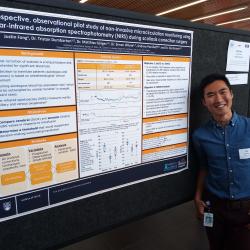 Medical student Justin Fong next to his poster