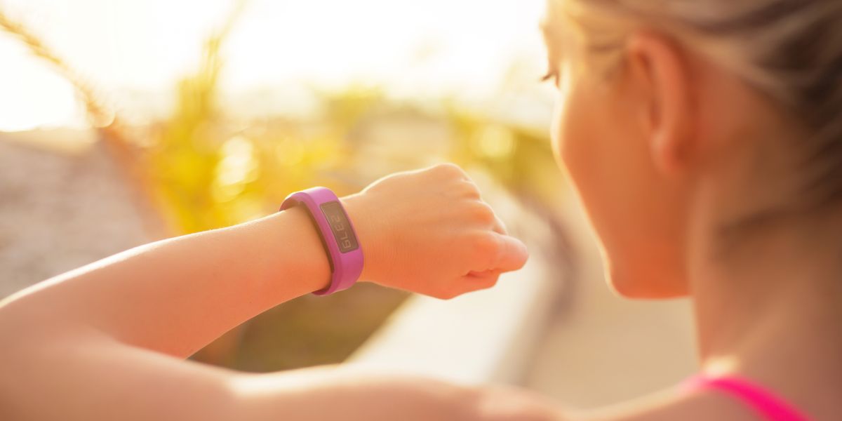 Female checking their wearable device