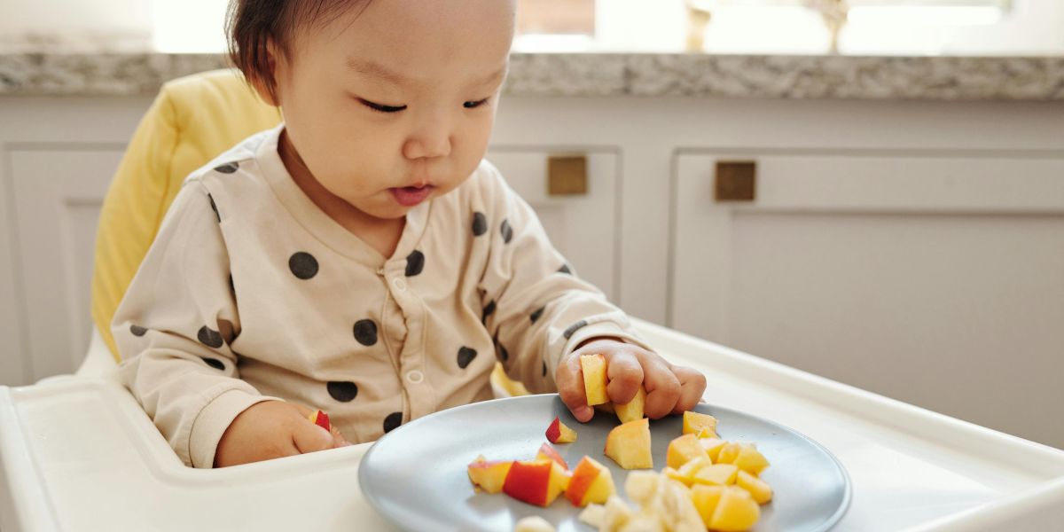 One-year-old eating fruits