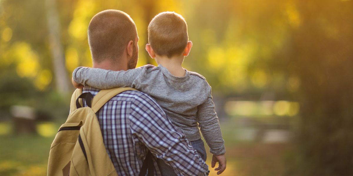 Child being carried by an adult