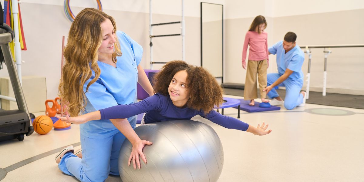 Children with physical therapists.